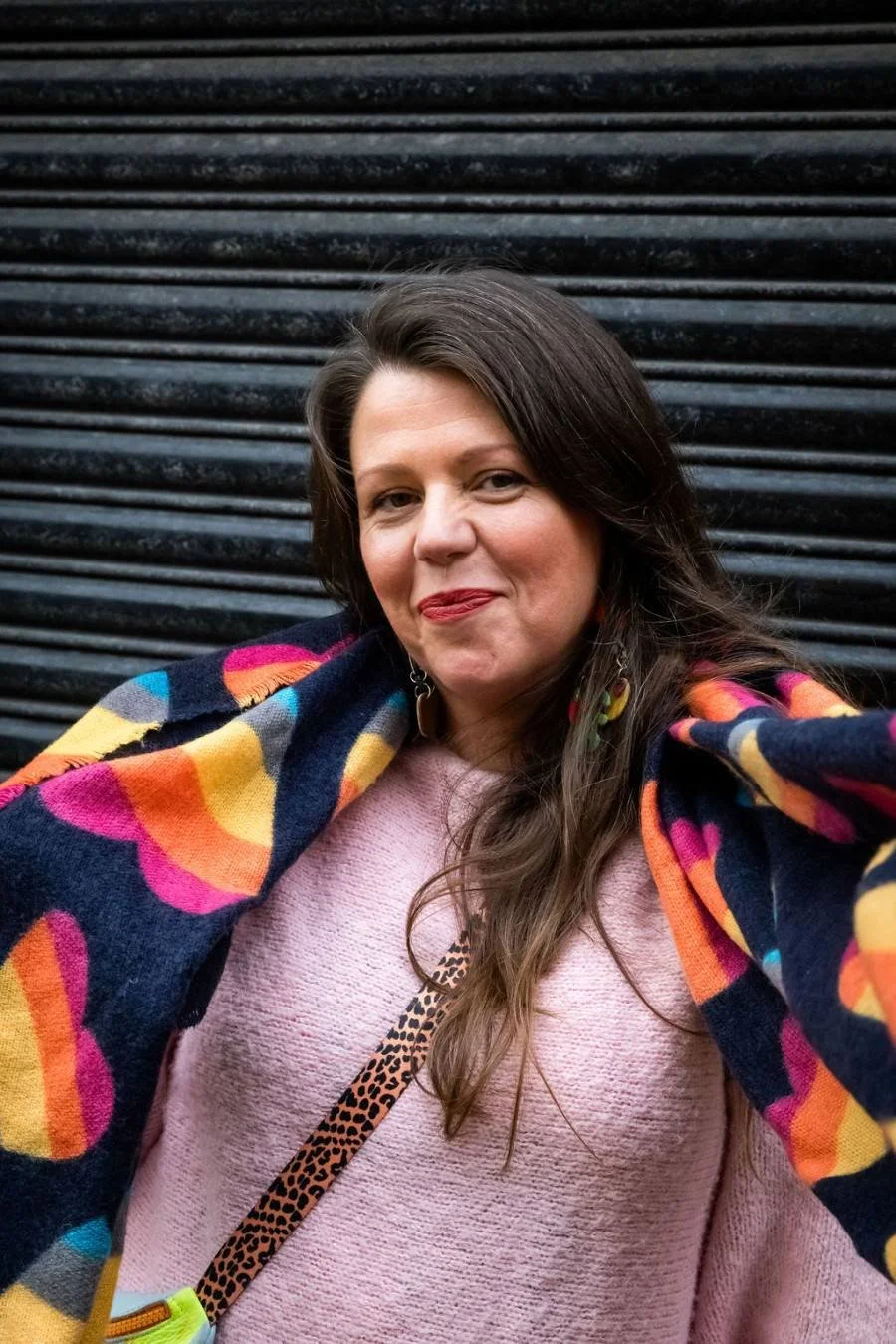 Sara Maxwell in colourful scarf is a trainer at wise monkey