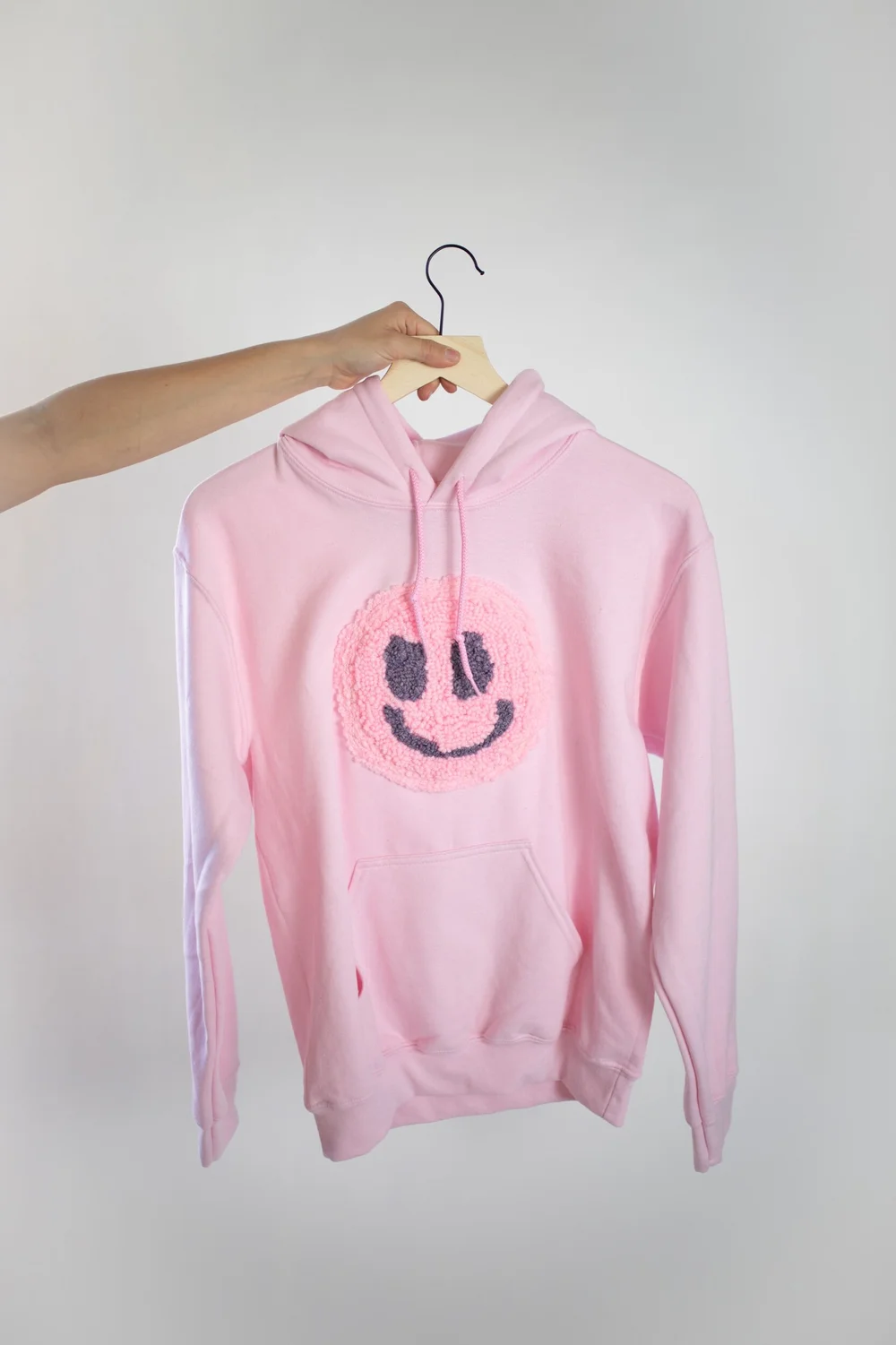 Pink smiley face hoodie sales