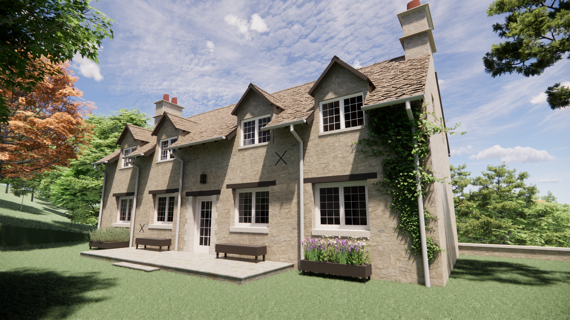 A stone house with a steep shingled roof, multiple dormer windows, and several chimneys. The house has a white door, flower boxes, and is surrounded by green trees and lawn under a partly cloudy sky.