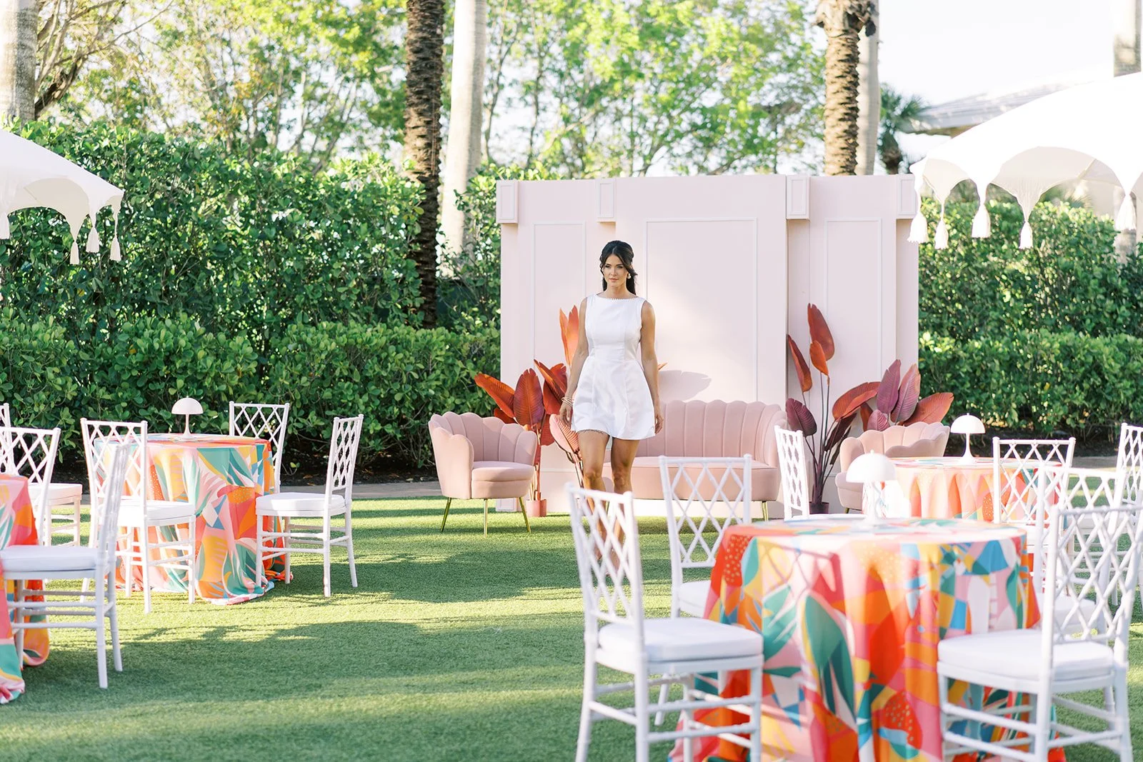 Pink Coco Wall, Coco Love Seat, Coco Arm Chairs, Pink Palm Decor, White Diamondback Chairs, White Cabaret Lamps (Photography by Brittany Bekas Photography, Design by CocoLuna Events)