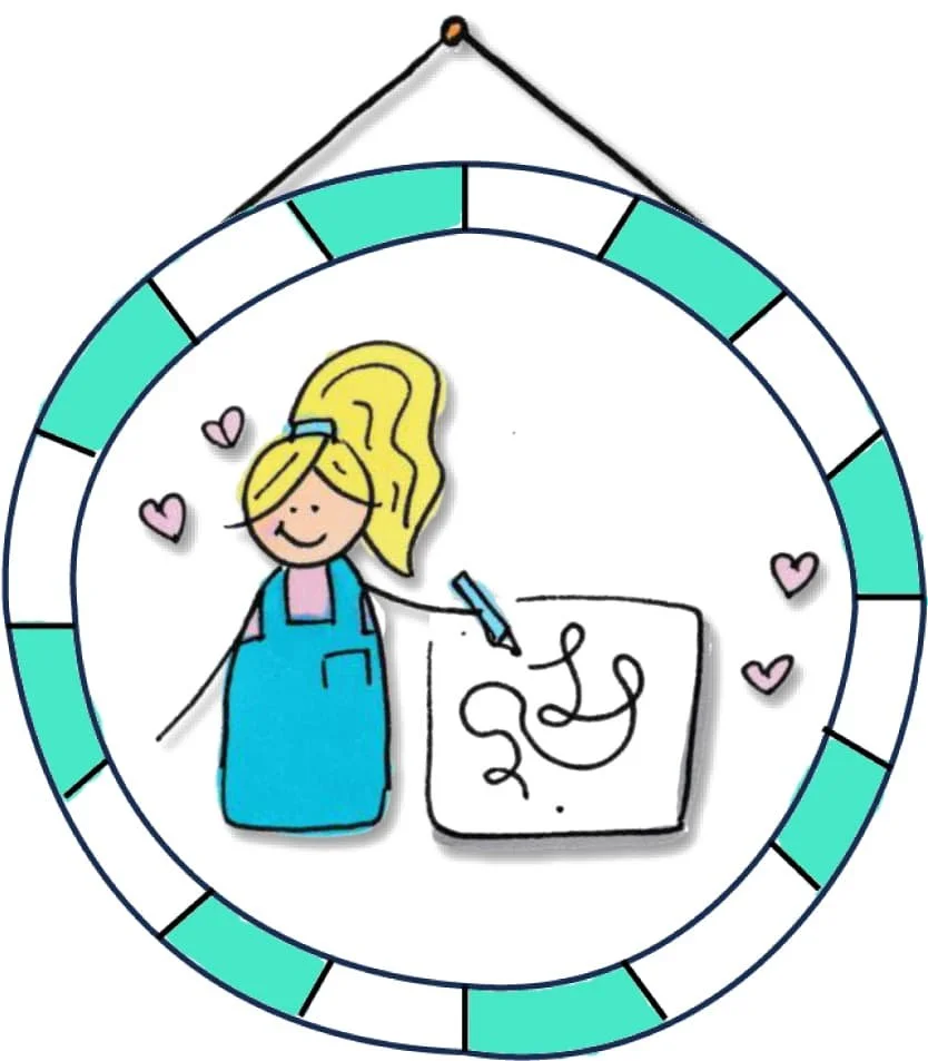 Hand-drawn circular picture frame with turquoise and white sections, featuring the Laura character from OCD Doodles drawing a doodle on paper, surrounded by small pink hearts.