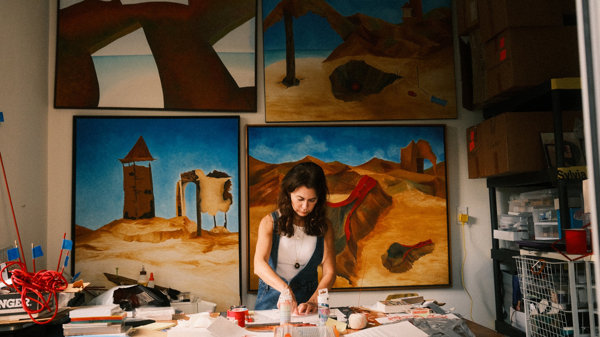 Sylvia Riquezes working on a new piece in her art studio.