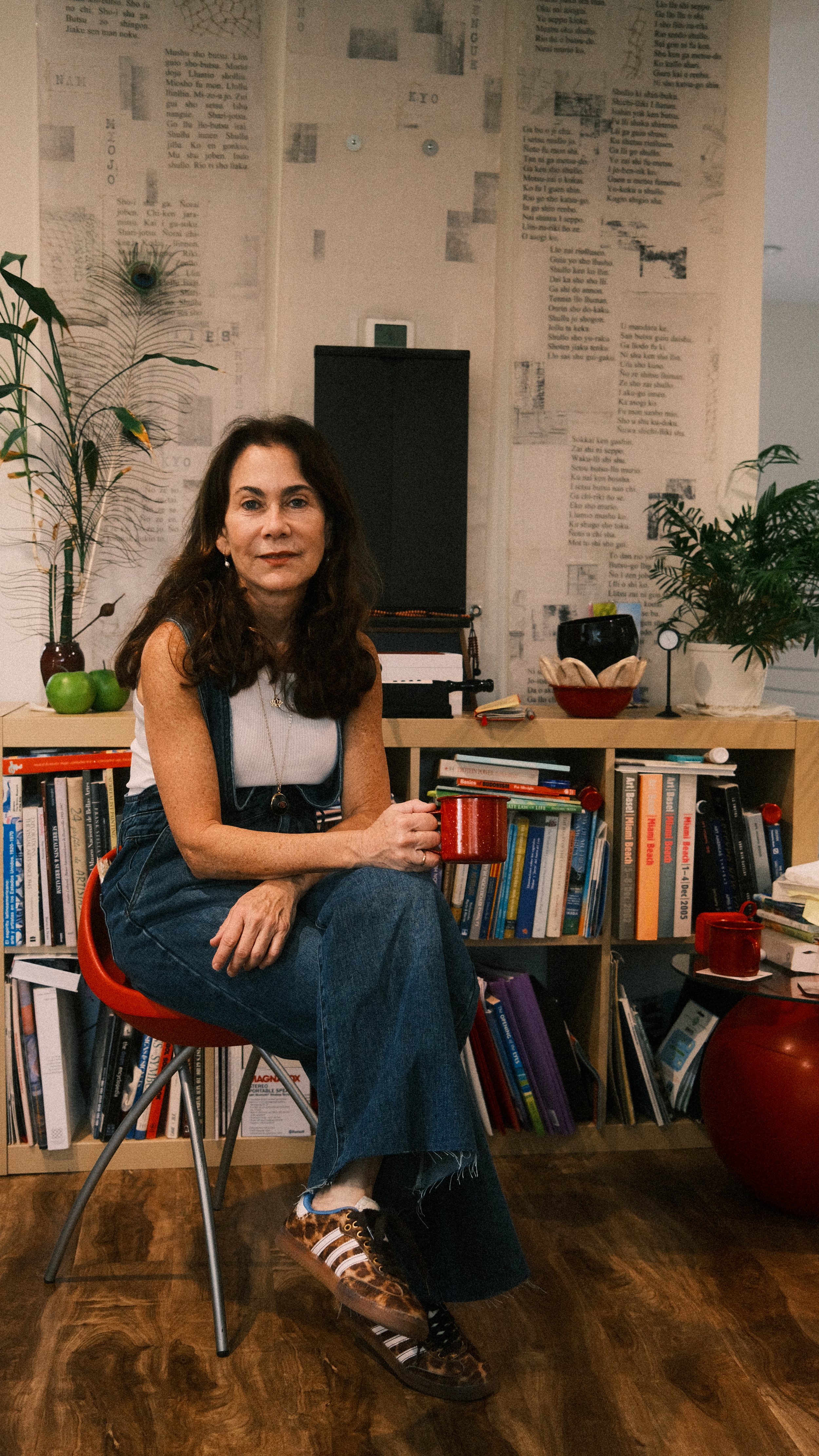 Sylvia Riquezes sitting in her studio.