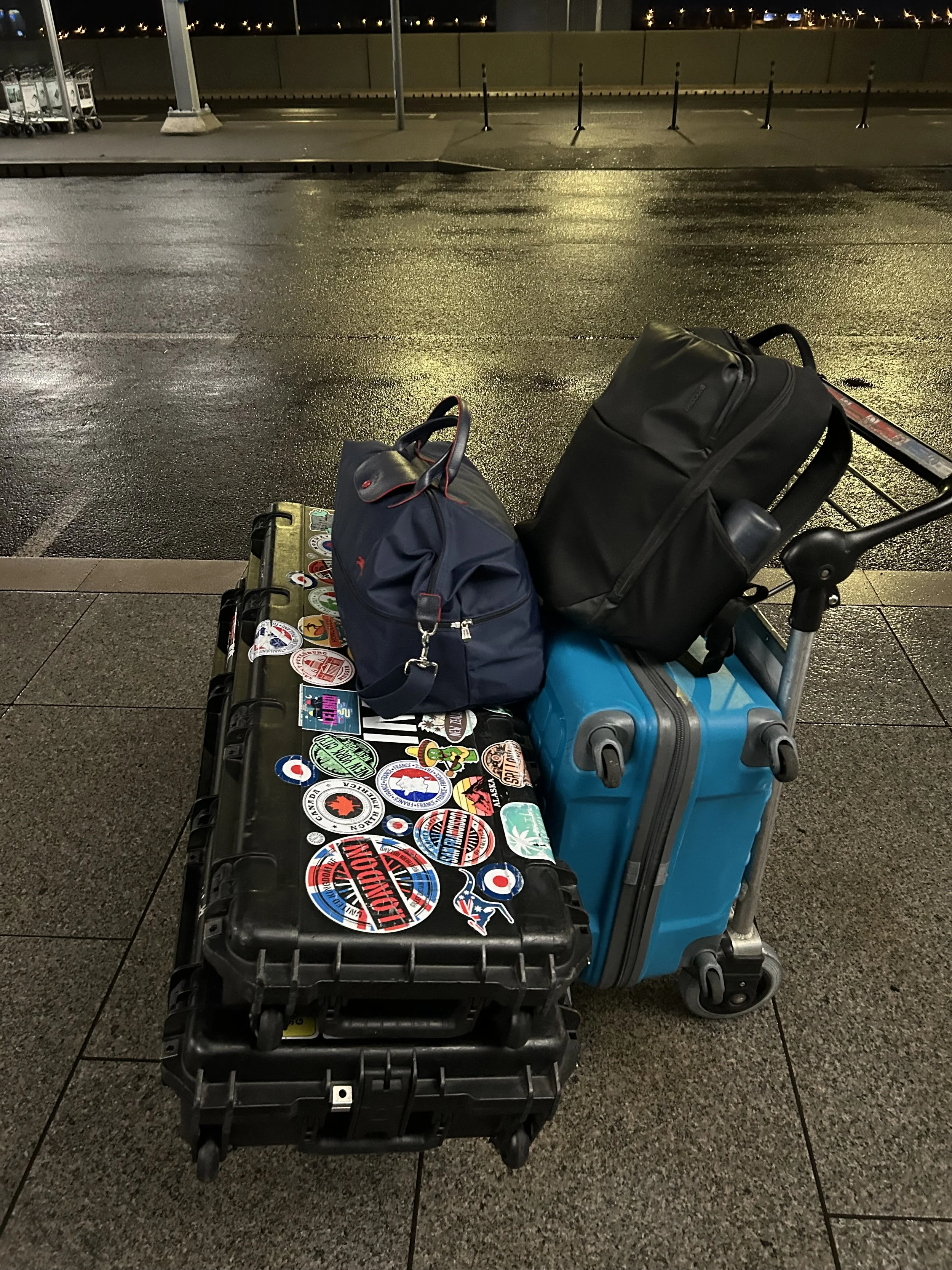 Ian's luggage on a trolley outside Heathrow terminal five at 2:30 in the morning