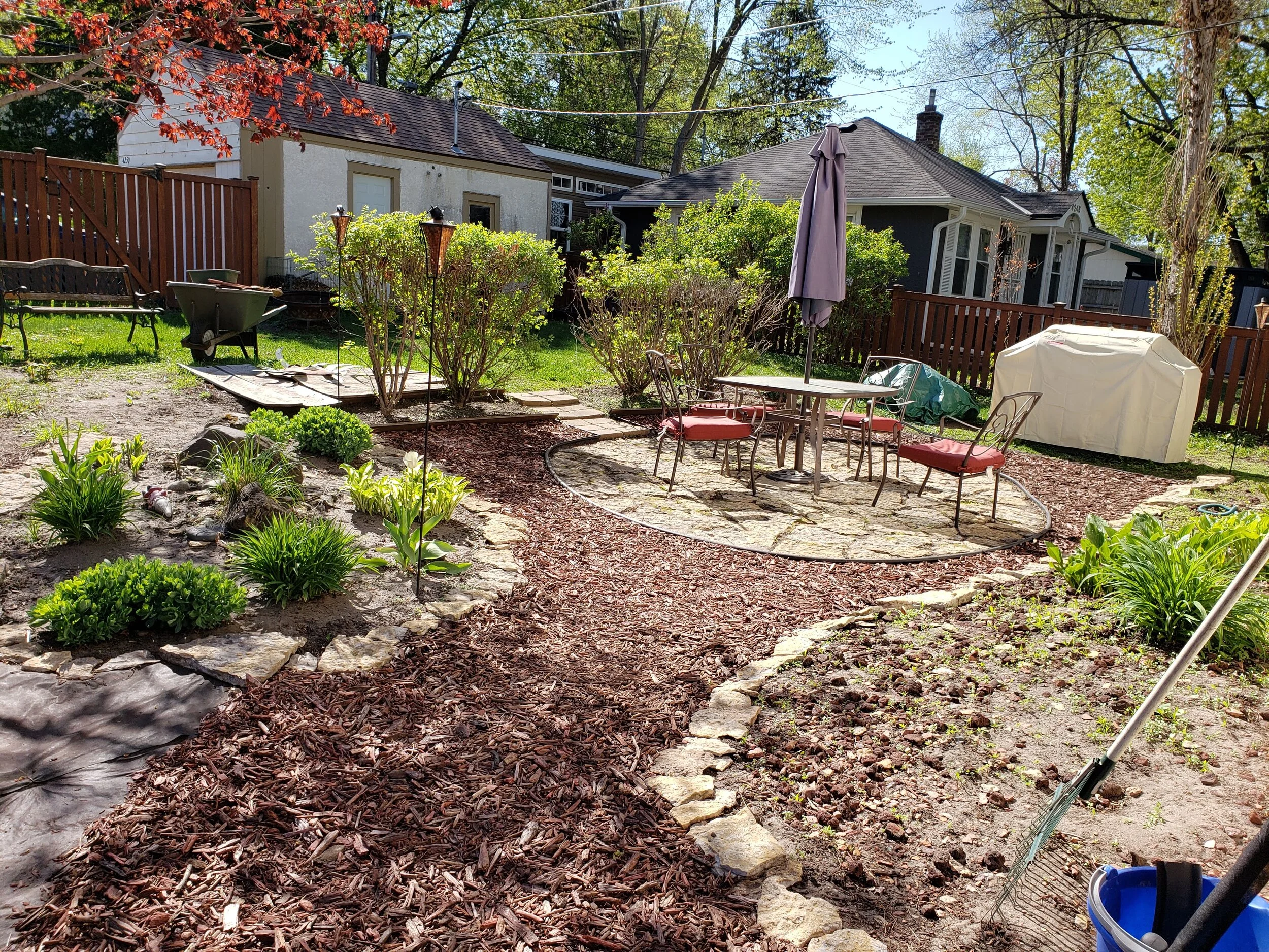 Spring clean up and Charlie's artistry & landscaping in the backyard.