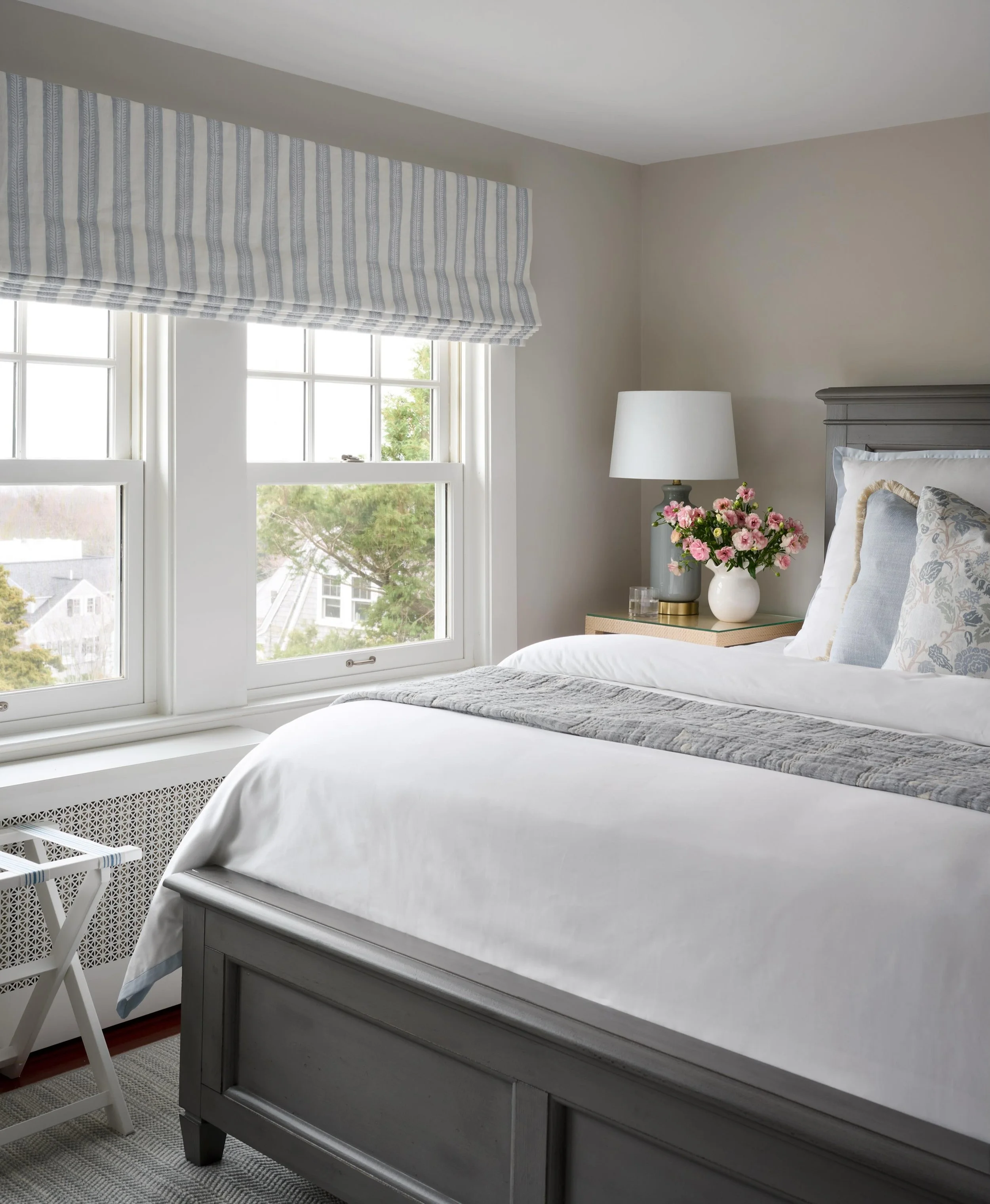 The New England weather might not be cooperating, but this is exactly the kind of spot I want to wake up in this weekend. 🌧️ 
Coffee + needlepoint + a cozy bed = perfection. ☕️🪡 

Interior Design: @jessiesheehaninteriors 
Styling: @seanwilliam_styl