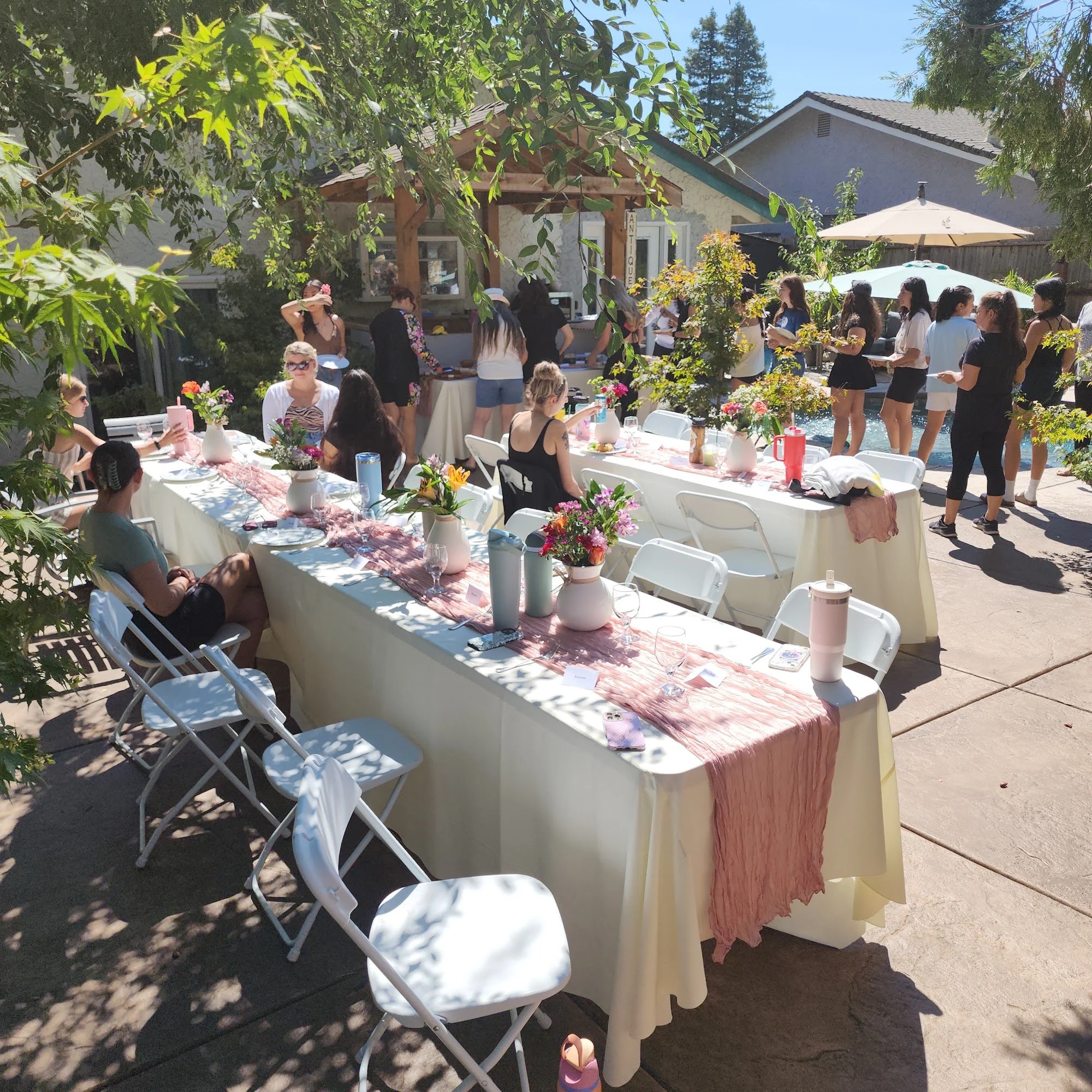 Roseville Ranch Montessori teachers gathering for a staff appreciation lunch on the patio during staff development week