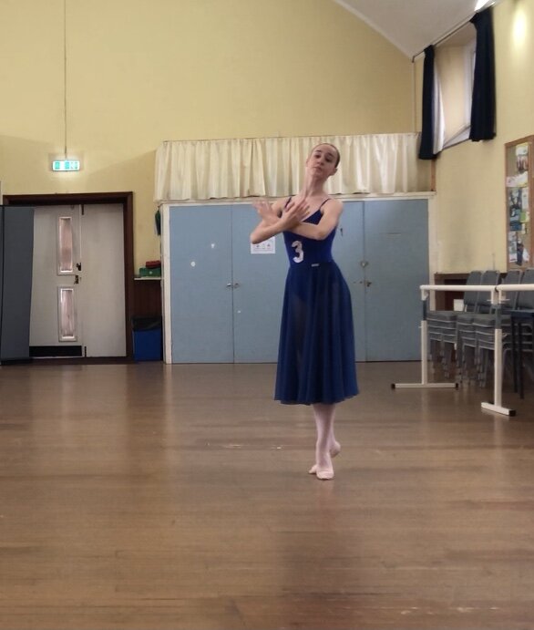 Alta Academy of Dance Brighton, Ballet dancer on demi-pointe with crossed arms