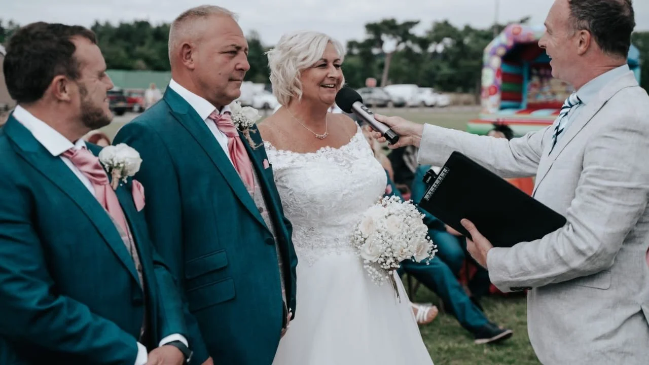 Wedding ceremony on a rugby pitch complete with bouncy castle