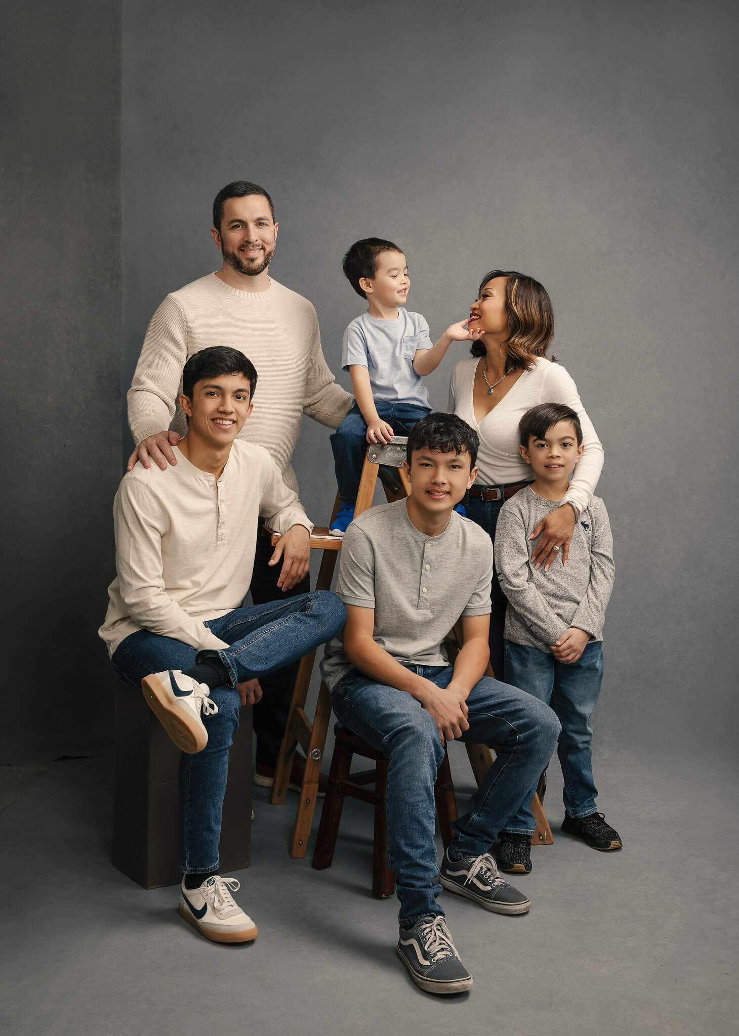 Casual studio portrait of a family by Mayumi Acosta Photography