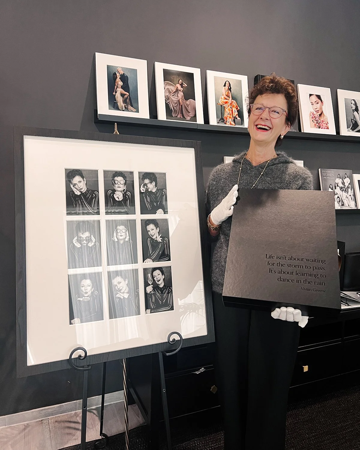 Happy-client-holding-her-portrait-collection-from-a-photoshoot-with-Innsbruck-Photographer-Mayumi-Acosta.jpg