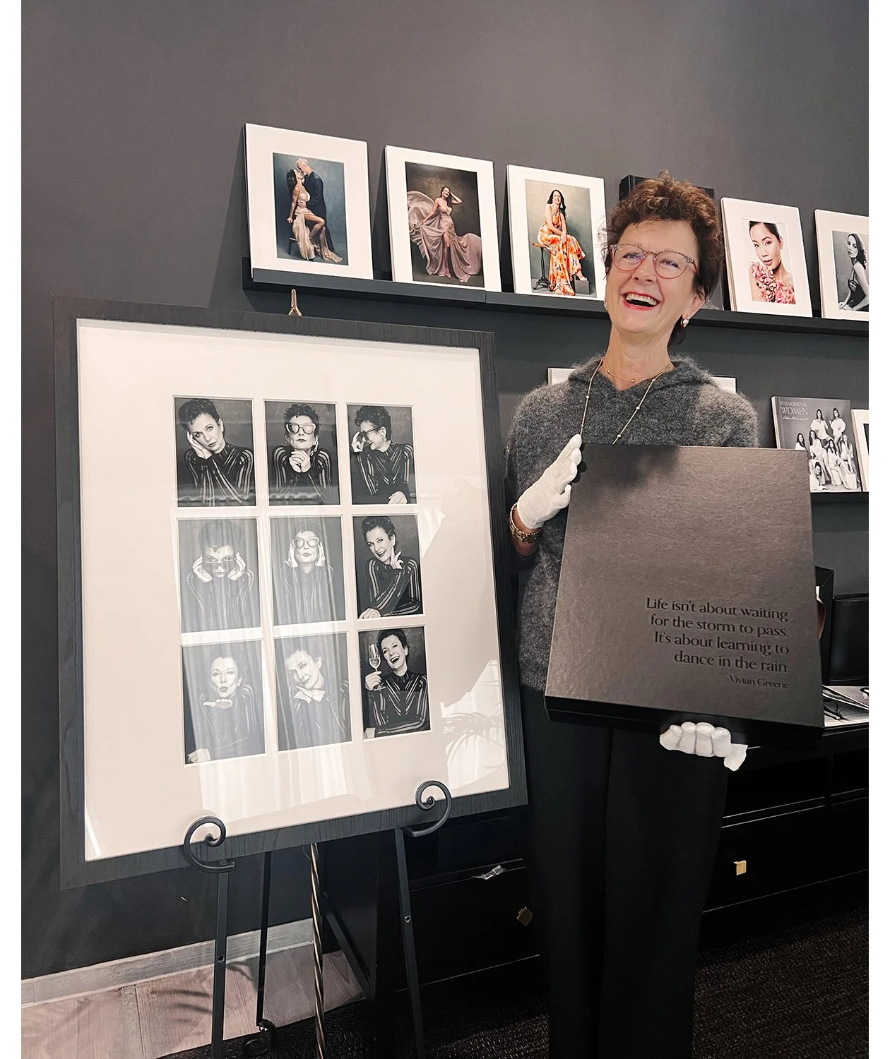 Happy-client-holding-her-portrait-collection-from-a-photoshoot-with-Innsbruck-Photographer-Mayumi-Acosta.jpg