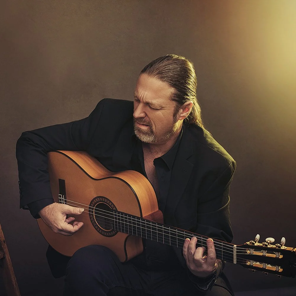 Editorial studio portrait of a flamenco guitarist by portrait photographer Mayumi Acosta Innsbruck
