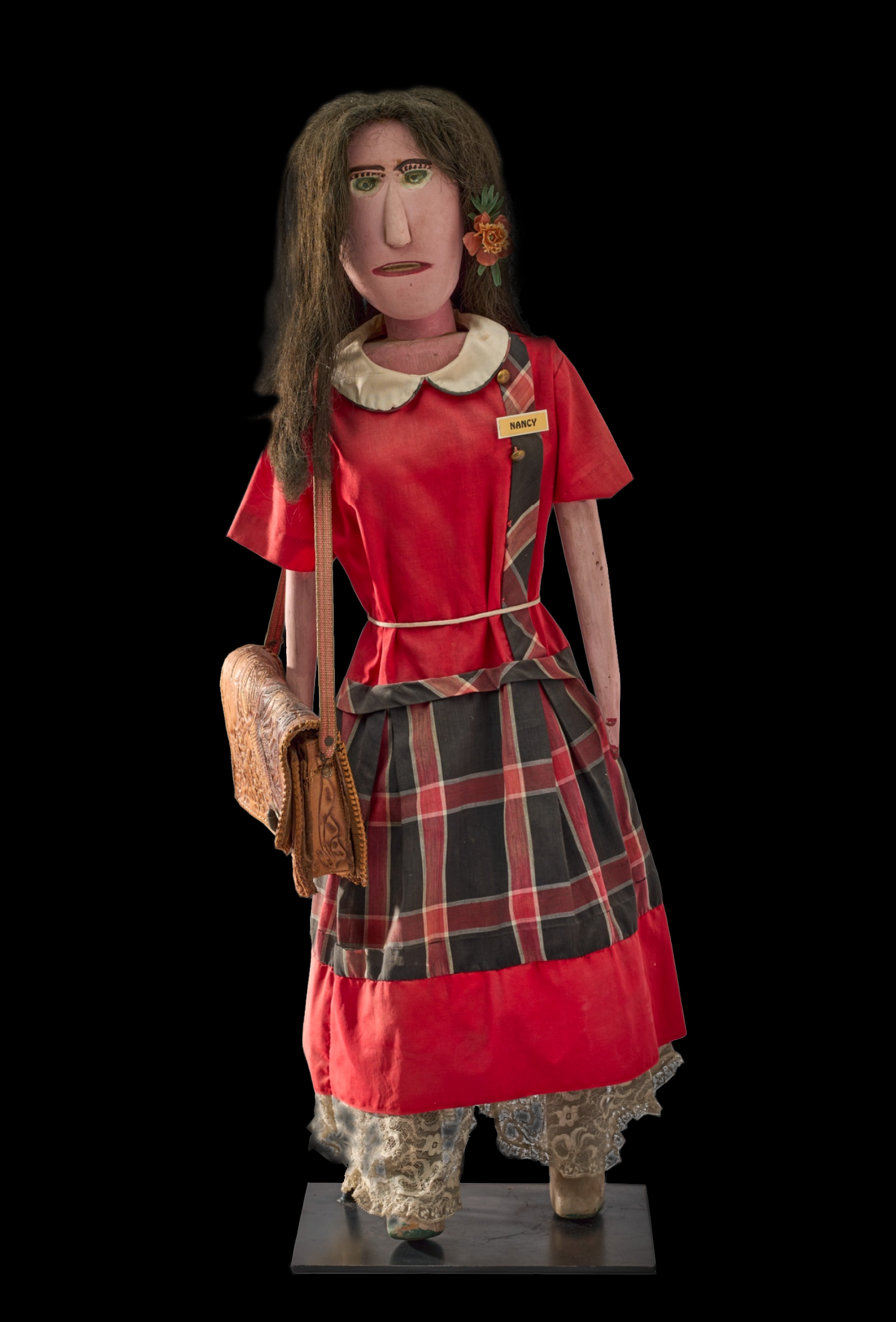 Nancy - 38 1/2 x 11 x 8 in - fabric, paint, acrylic hair and leather purse on carved wood - circa 1960