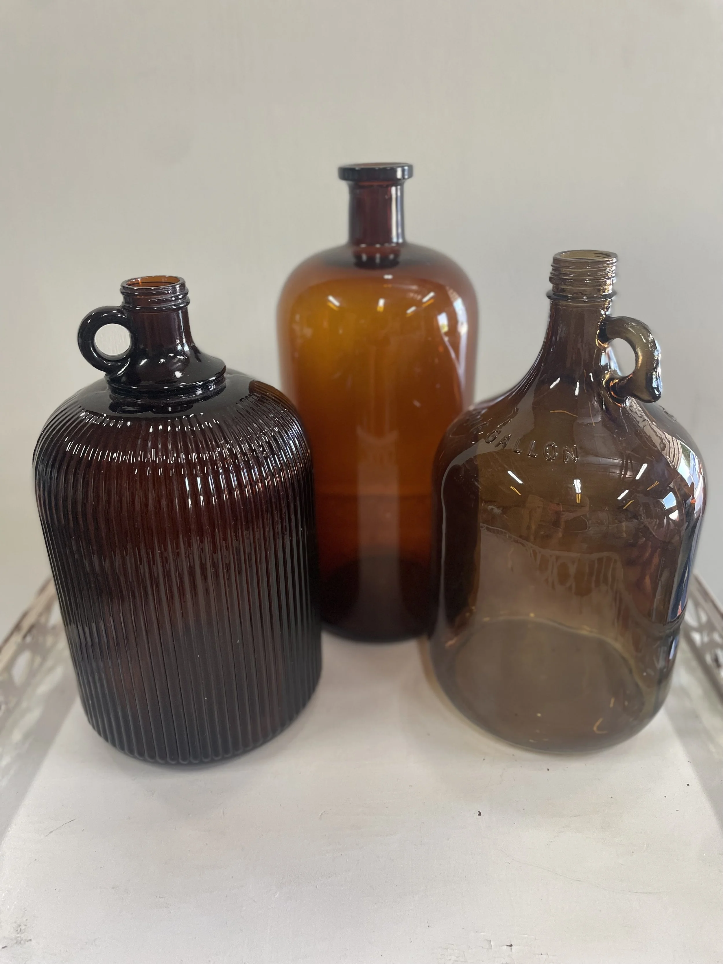 **Amber jug #1 (tall jug in the middle, 14" Tall x 5.5"  Wide) - $6  (1 available)
 **Amber Jug #2 (1 Gallon) - $6 each (3 available)