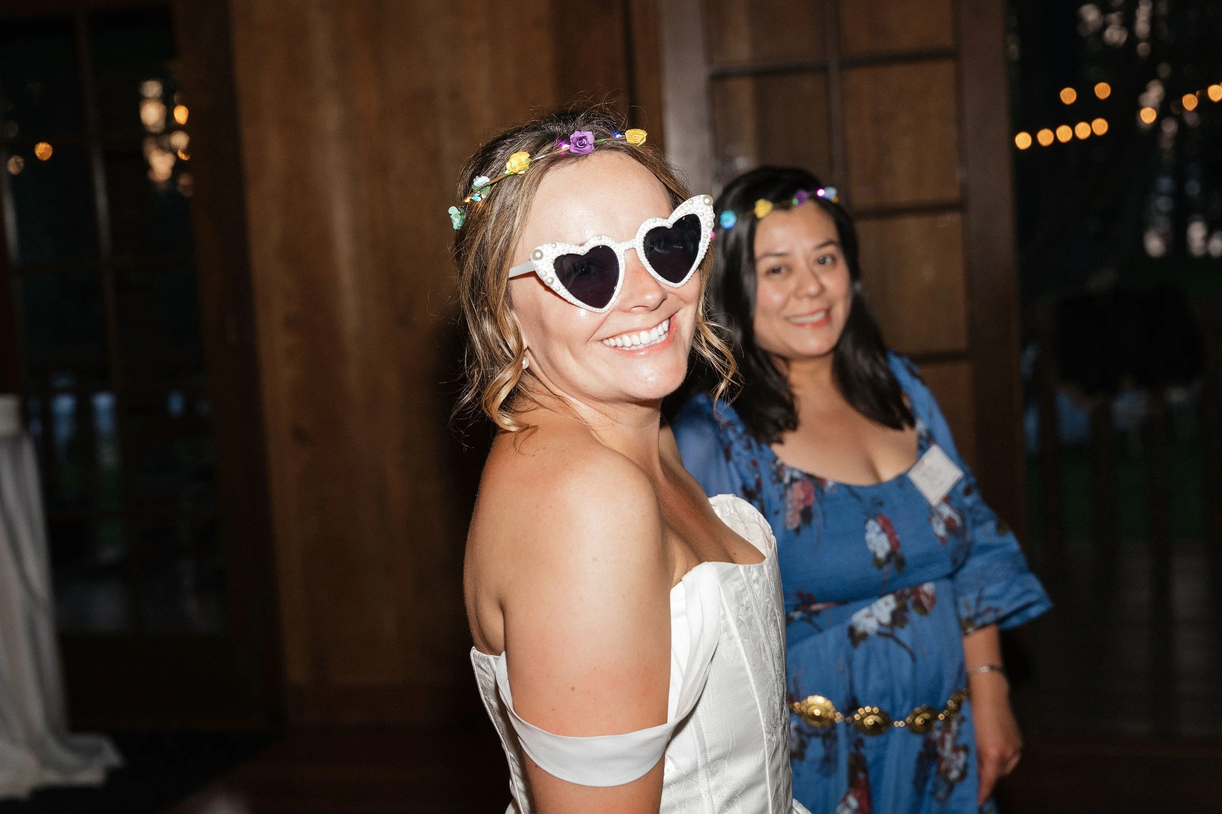 Bride with heart shaped glasses dancing