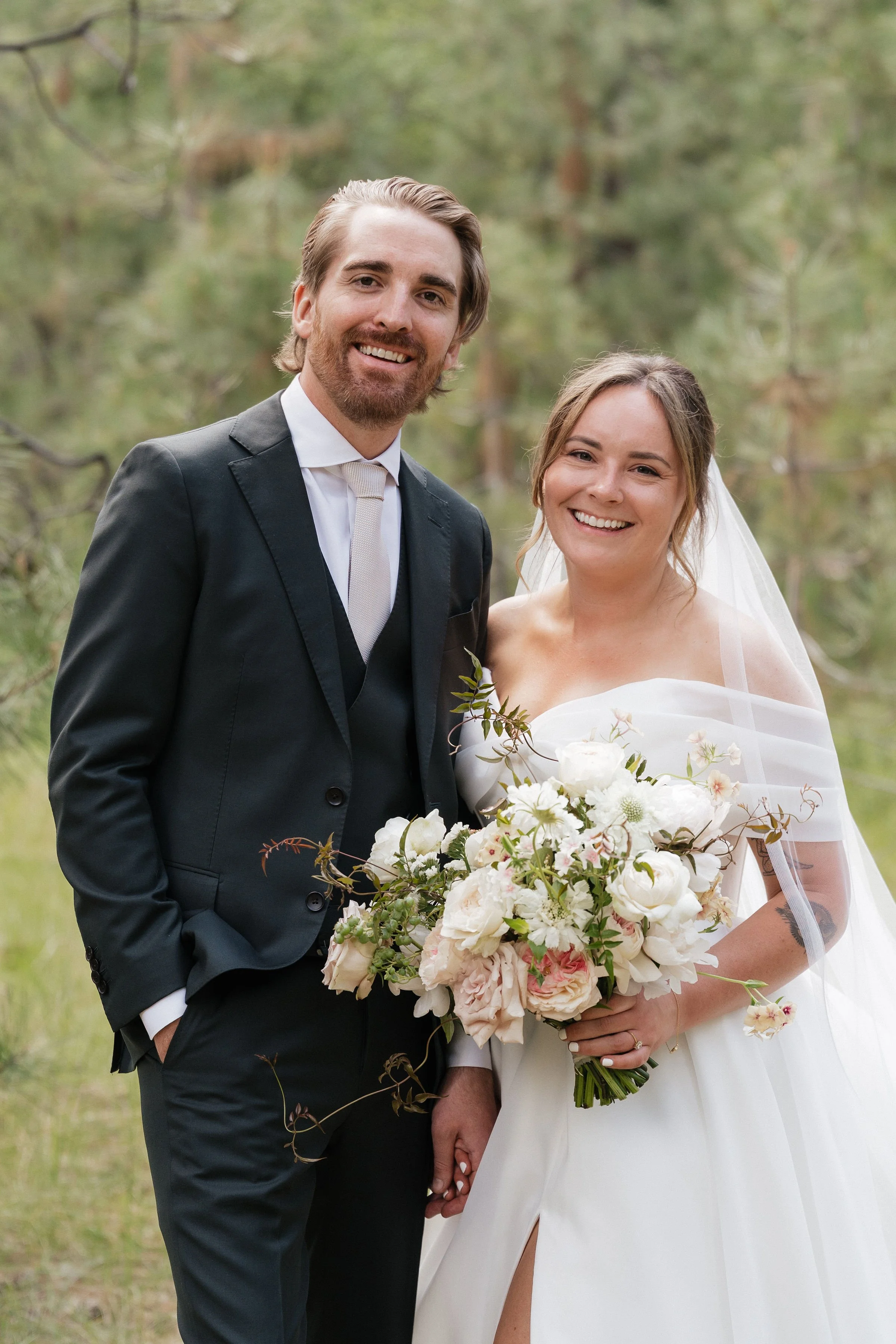 Blush pink, white peonies in a loose bridal bouquet