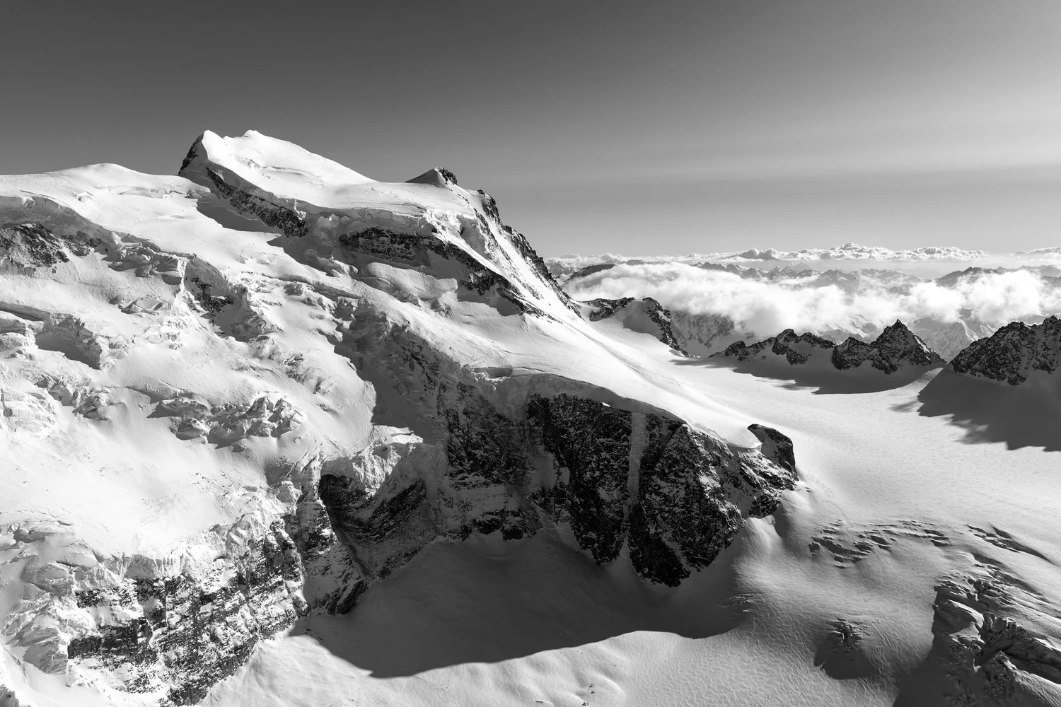 Grand Combin East Face (Black + White) shown at 30 x 20cm (Standard 3:2) in a living room
