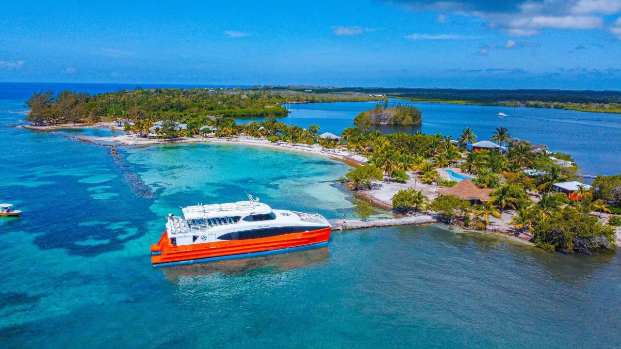 The Utila Dream Ferry docked in front of Laguna Beach on the island Utila.