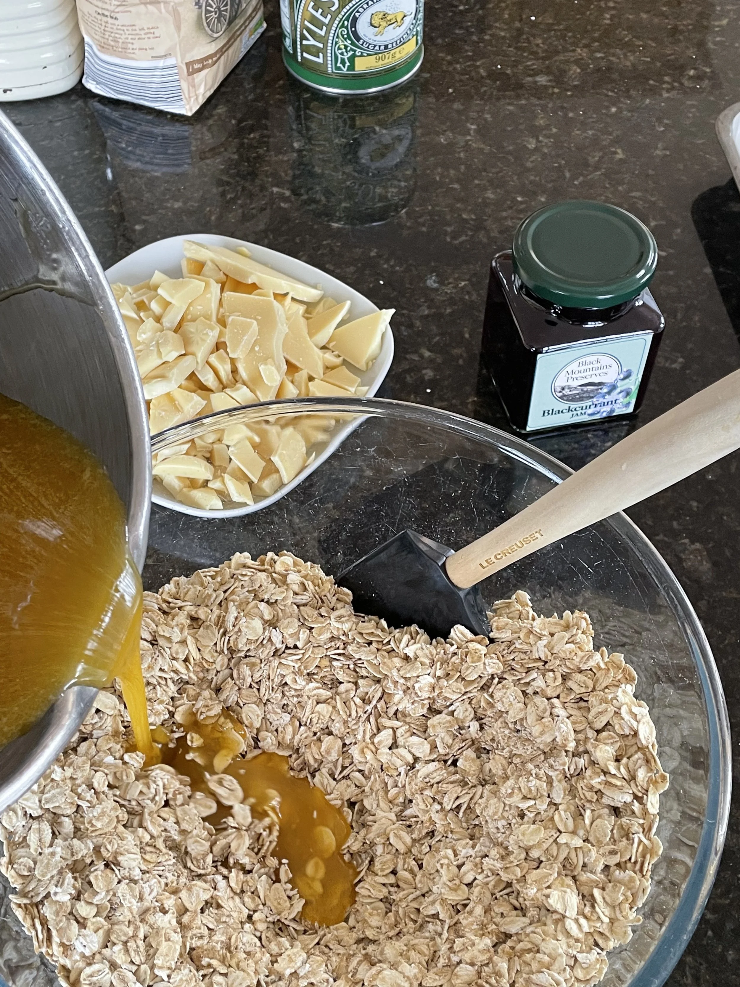 Add butter and syrup to the oats