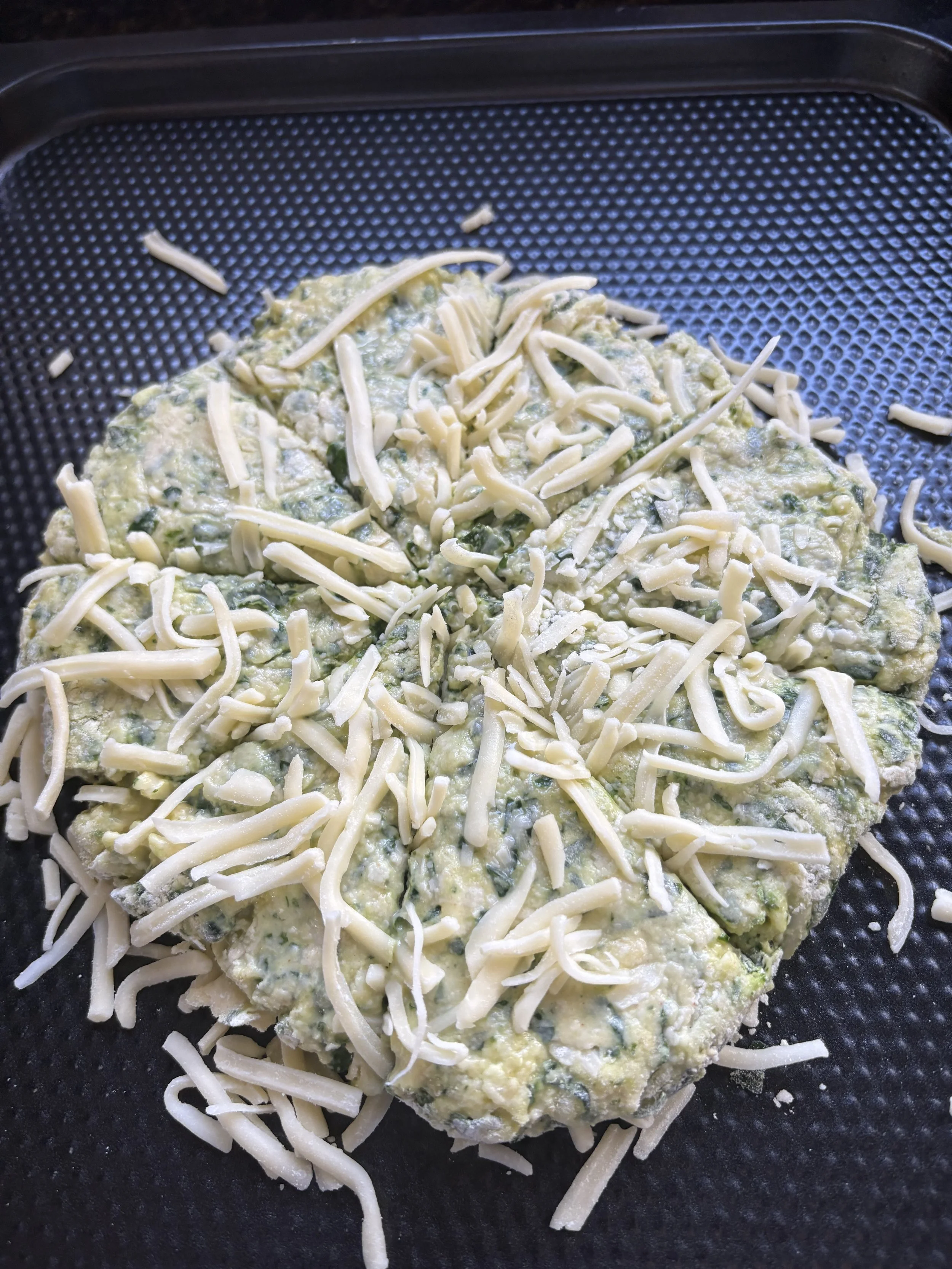 Shape into a round and mark for 8 segments and top with cheese