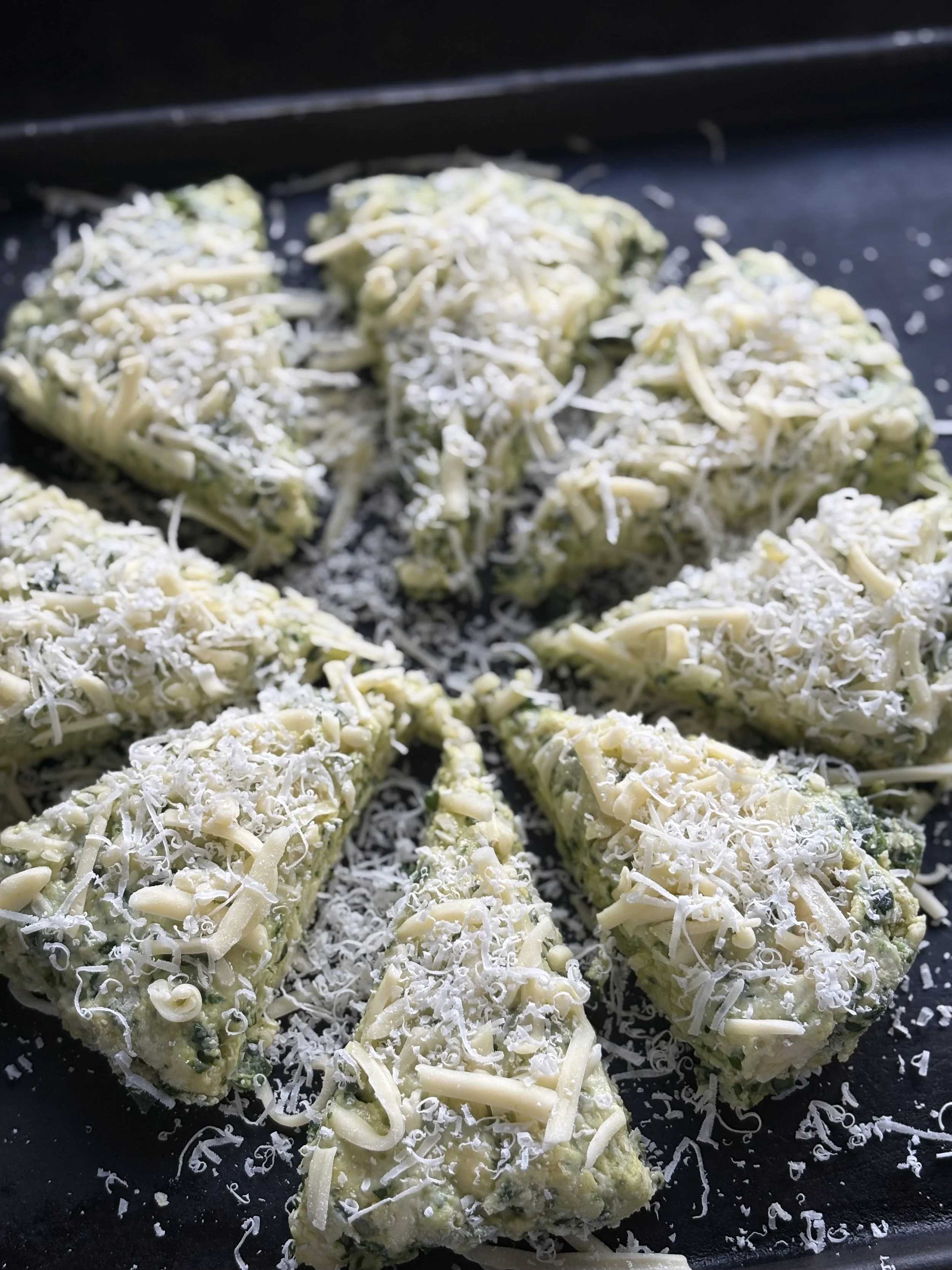 Cut into 8 segments and top with cheese and extra parmesan