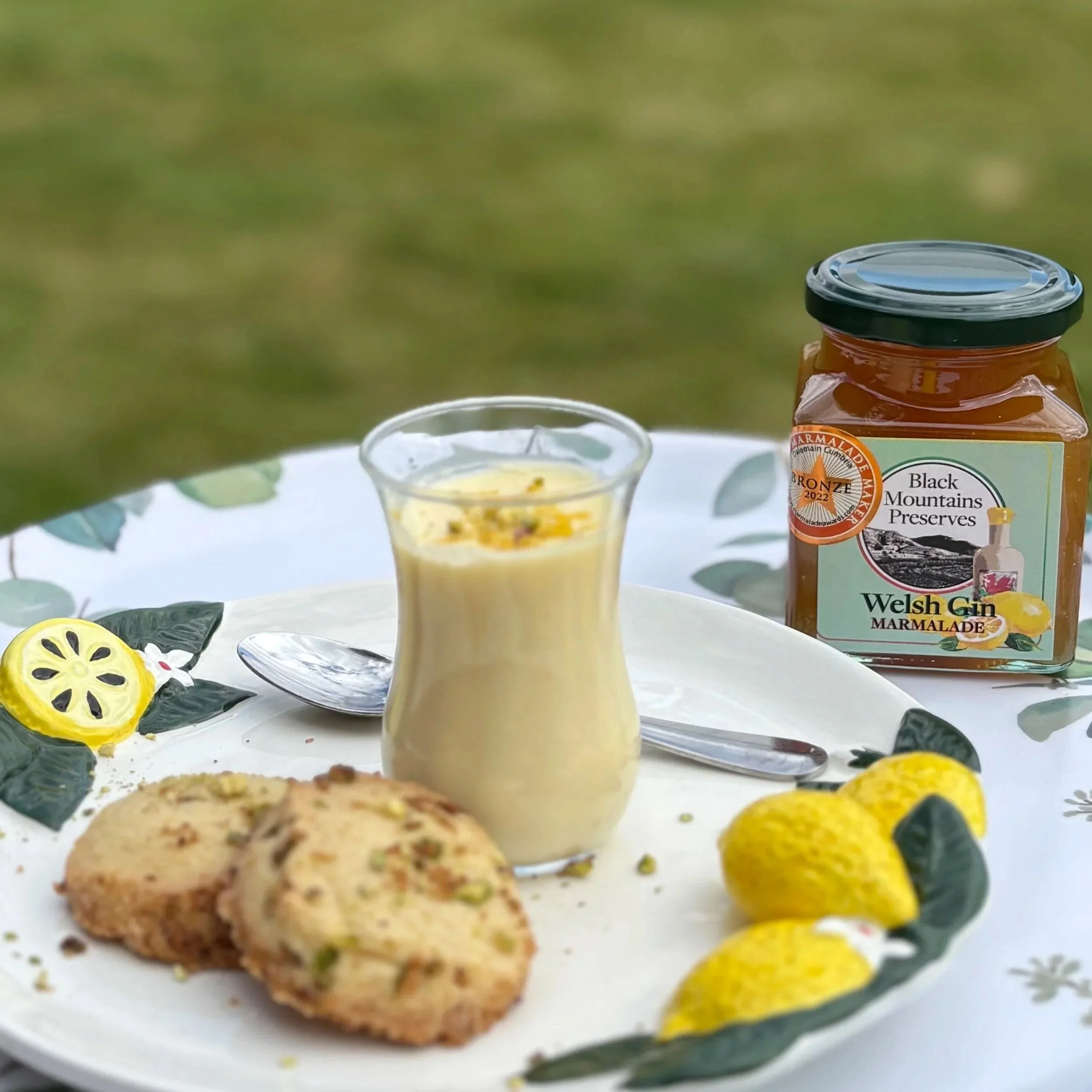 Lemon Posset with Welsh Lemon Gin Marmalade served with Lemon and Pistachio Shortbread
