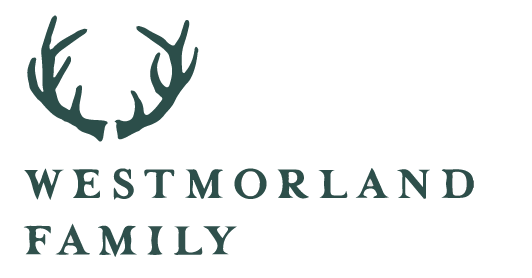 Westmorland Family logo featuring a stylized deer antler crest and text