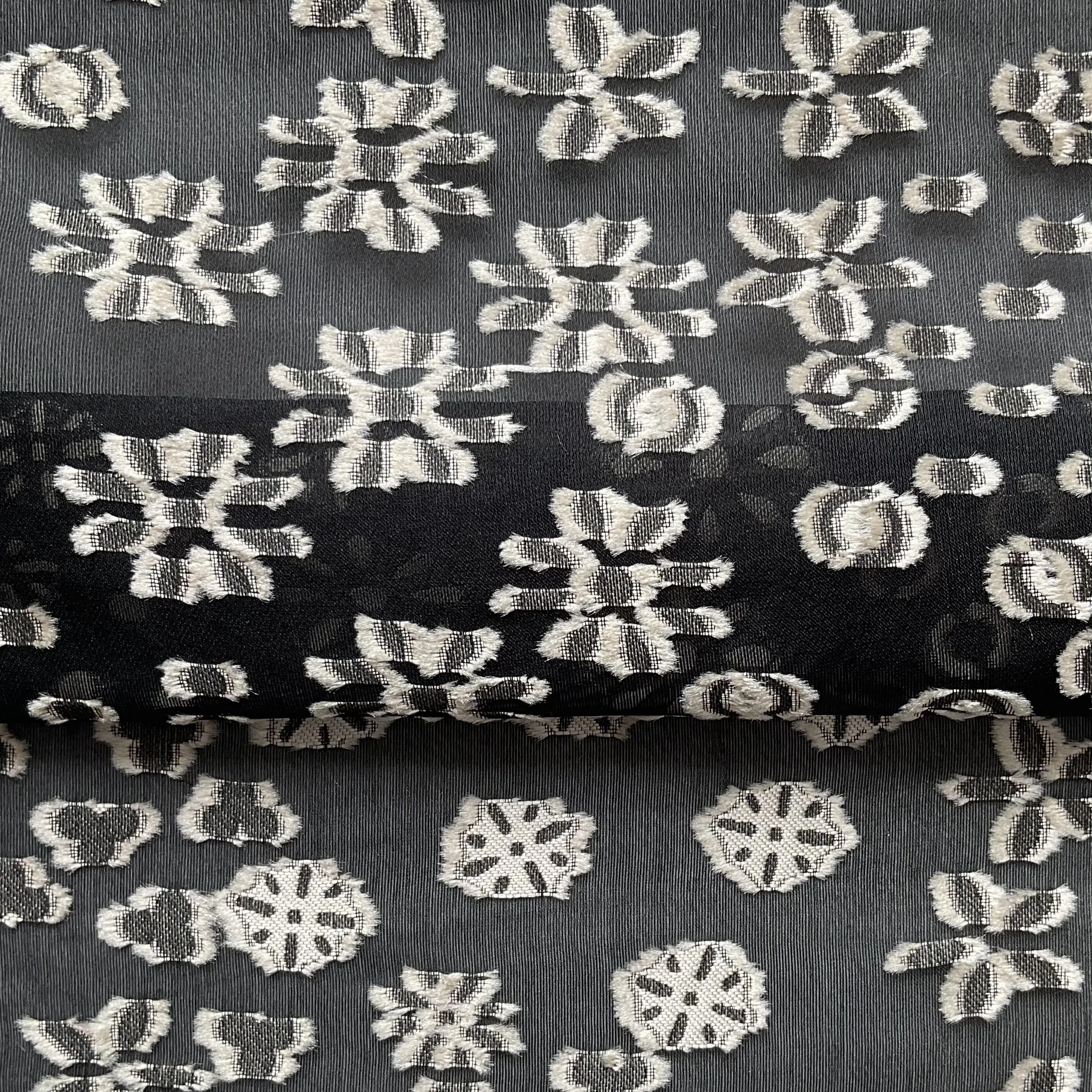Black silk organza with grey jacquard appliqué