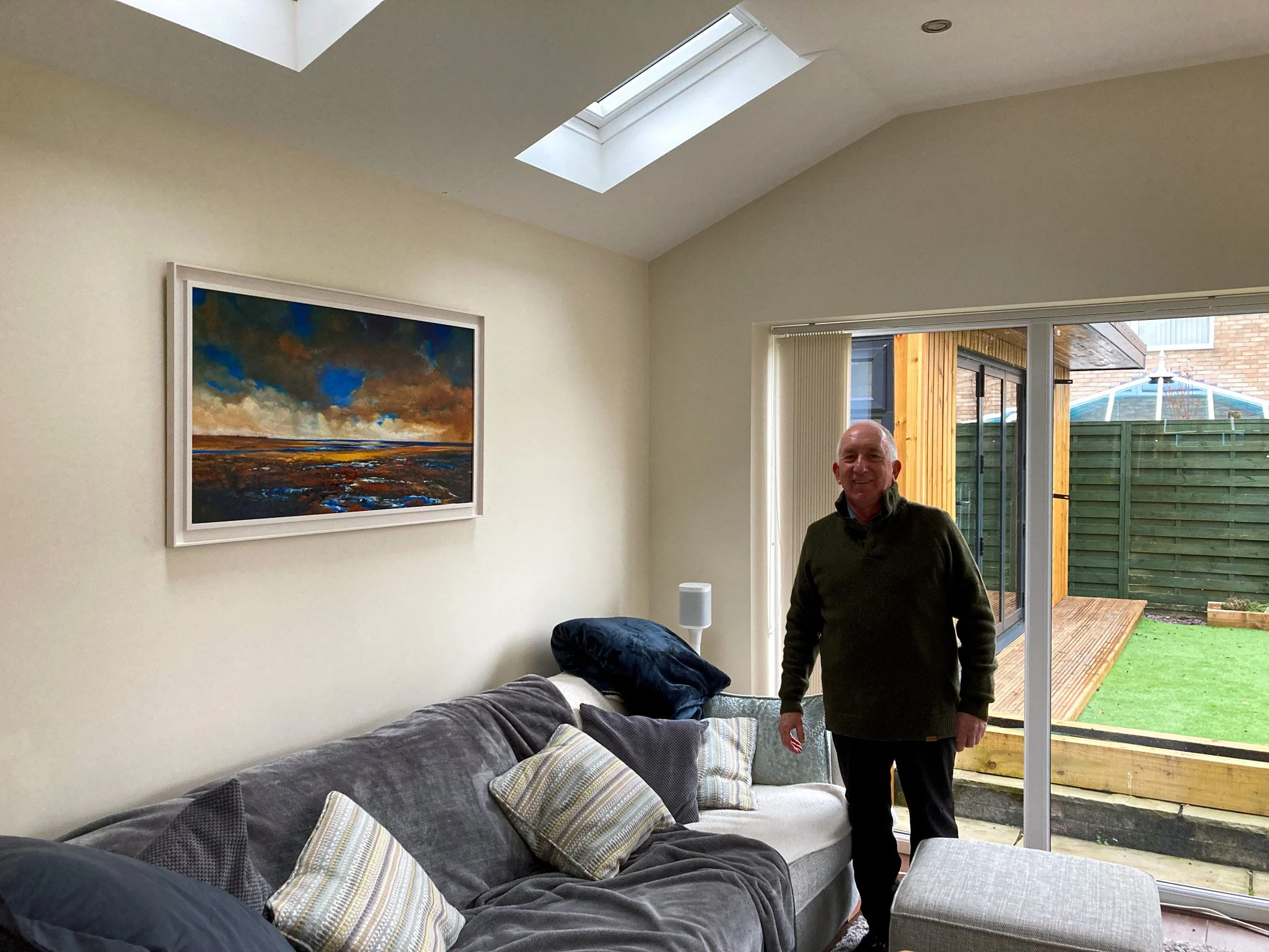 Keith Towler oil painting in-situ with happy customer.