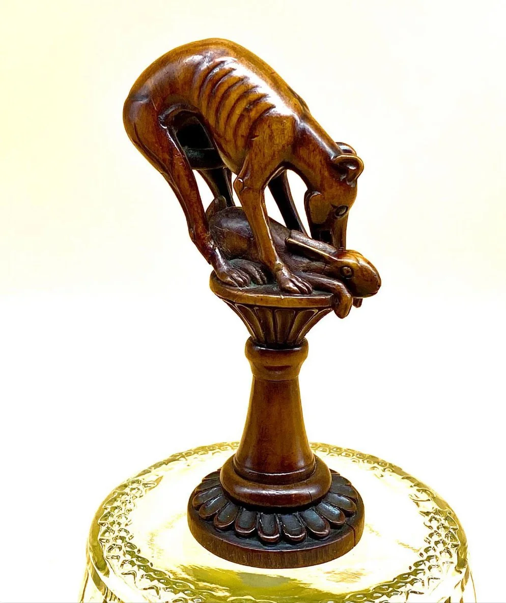 18th Century greyhound pipe Tamper  set on a base
