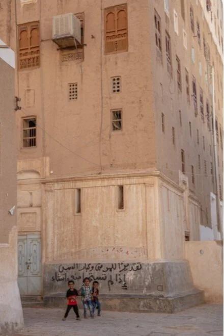 Children playing in the alleyways of Shibam. Hadhramaut, Yemen.