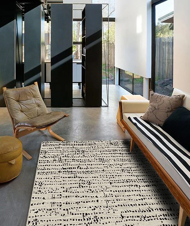 gray-rug-SKIP-WEAVE-black-white-room.png.jpeg