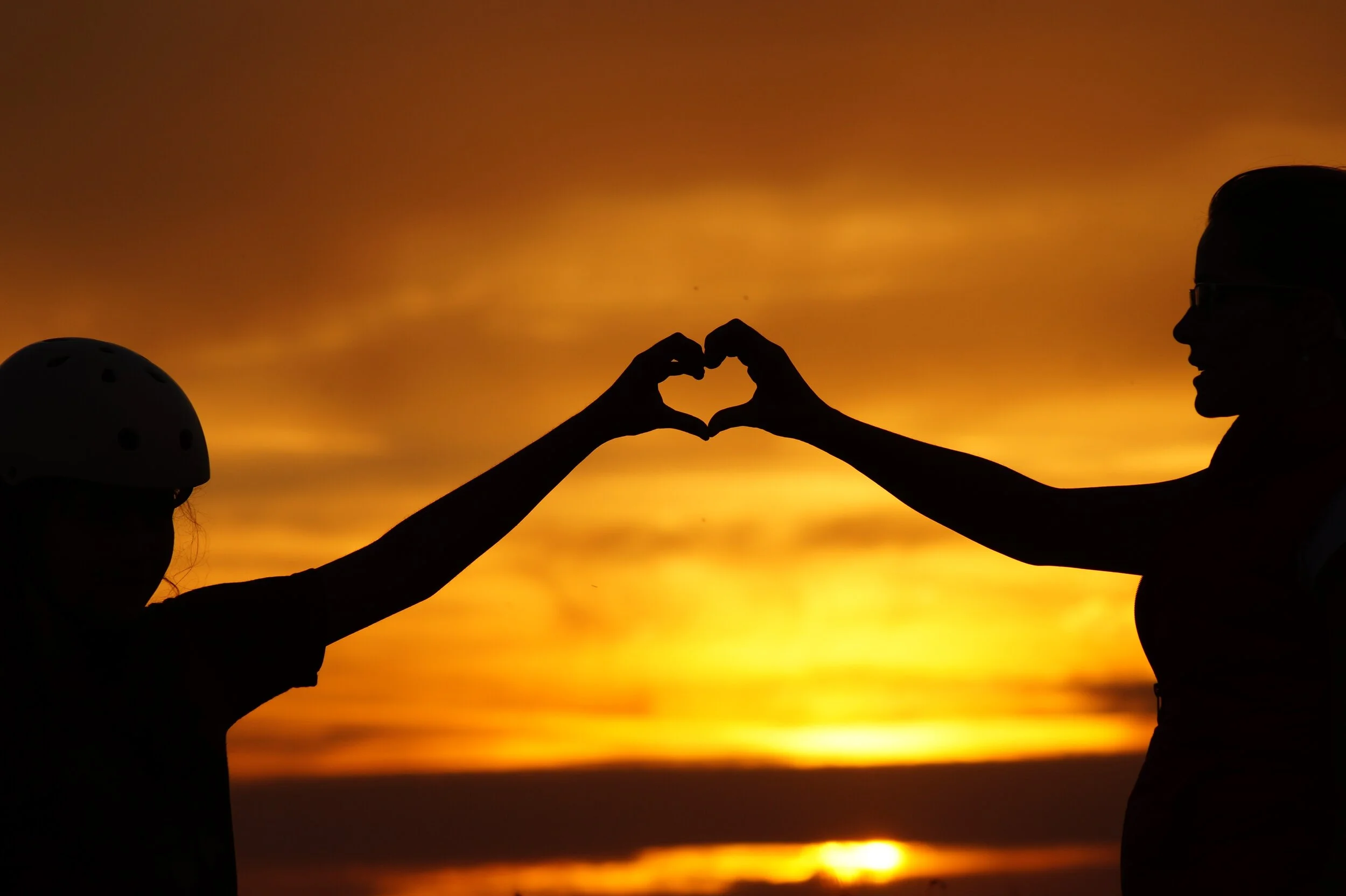 silhouette-of-man-touching-woman-against-sunset-sky-256807.jpg