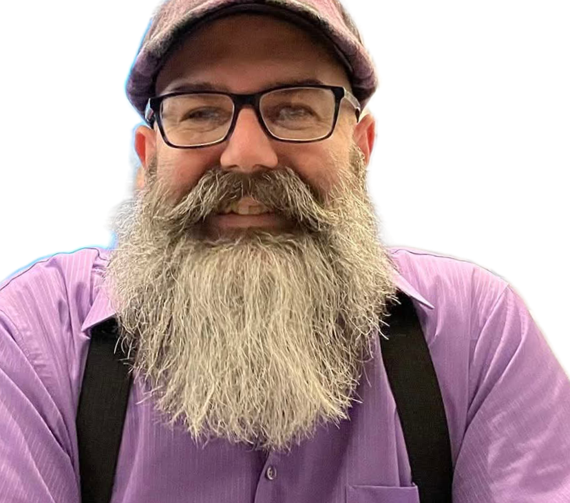 A man with a long gray beard, glasses, wearing a purple shirt and suspenders, smiling and wearing a flat cap. find cheap small group health insurance, company health insurance plans, business health insurance plans, affordable, cost effective