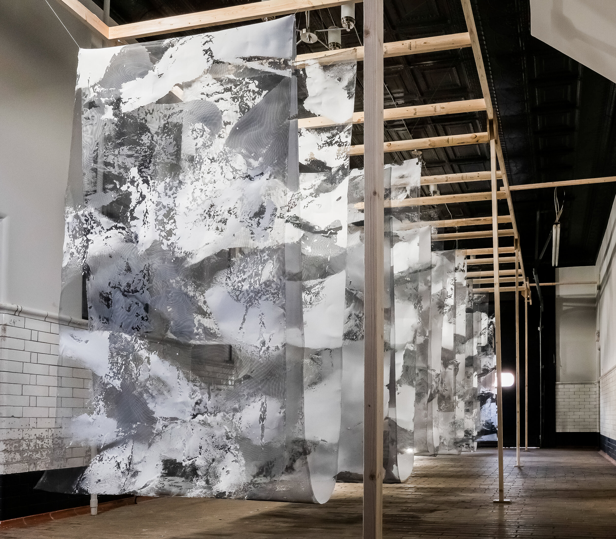Tahir Carl Karmali, PAPER:work installation in Newburg, New York, 2019. Handmade paper pulped from photocopied government-issued identification documents and commercial paper, with aluminum mesh 11h x 35l x 8w feet. Images courtesy of the artist.