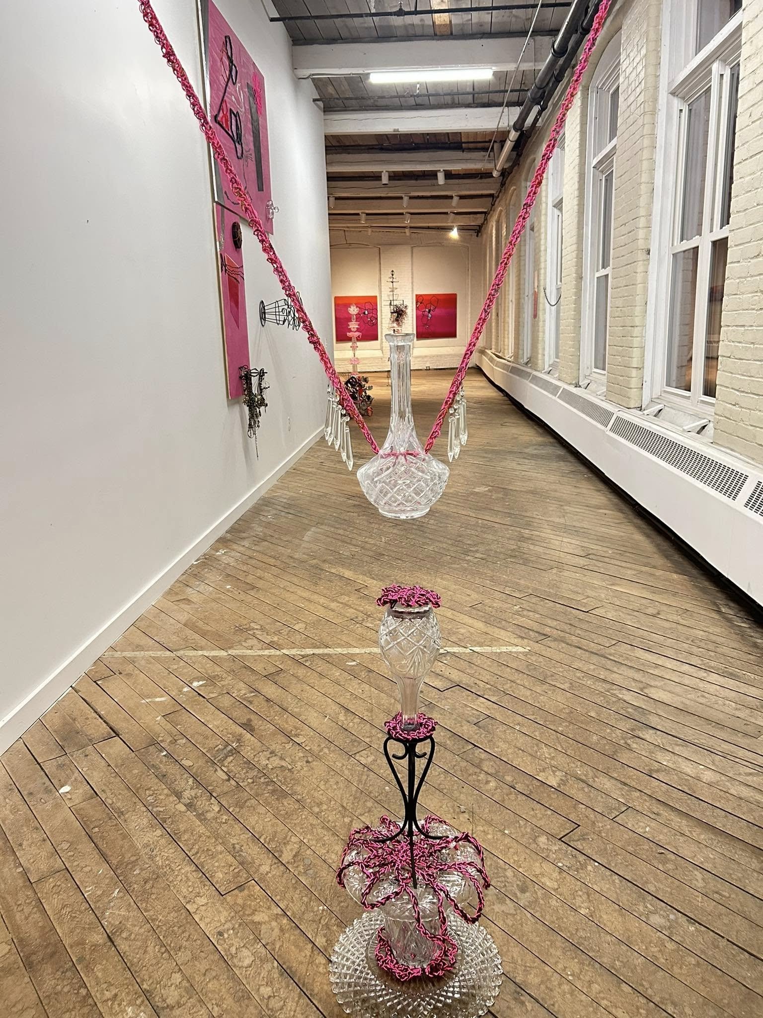 "Pink Levitate", 2025, crystal, cut glass, found object, yarn, wire, dimensions variable