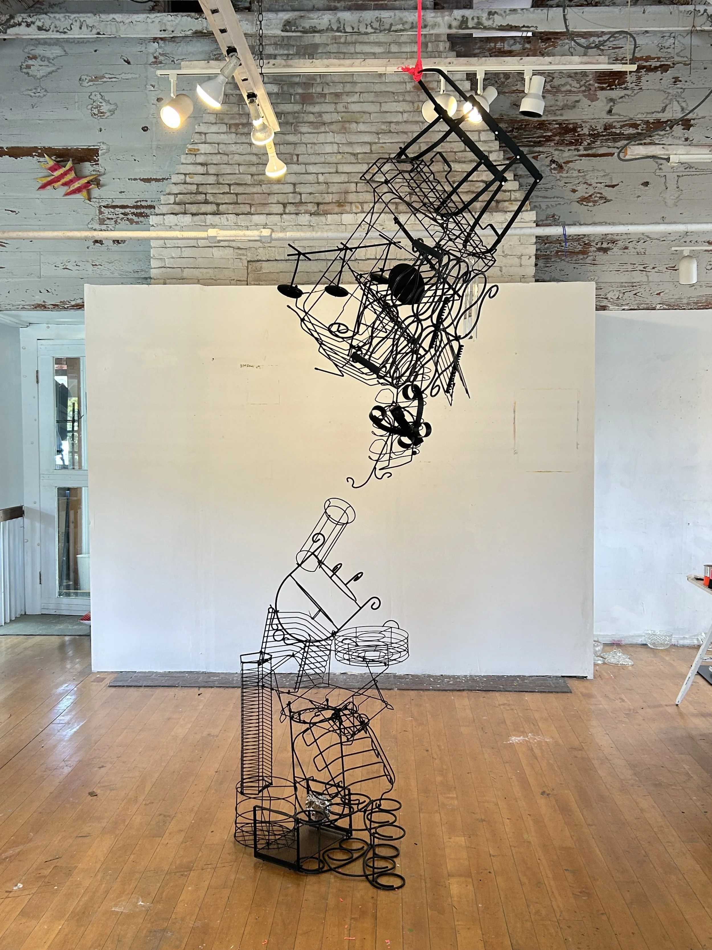 "Attraction", 2025, 36" x 14" x 144", found objects, zip ties, construction string, crystals
