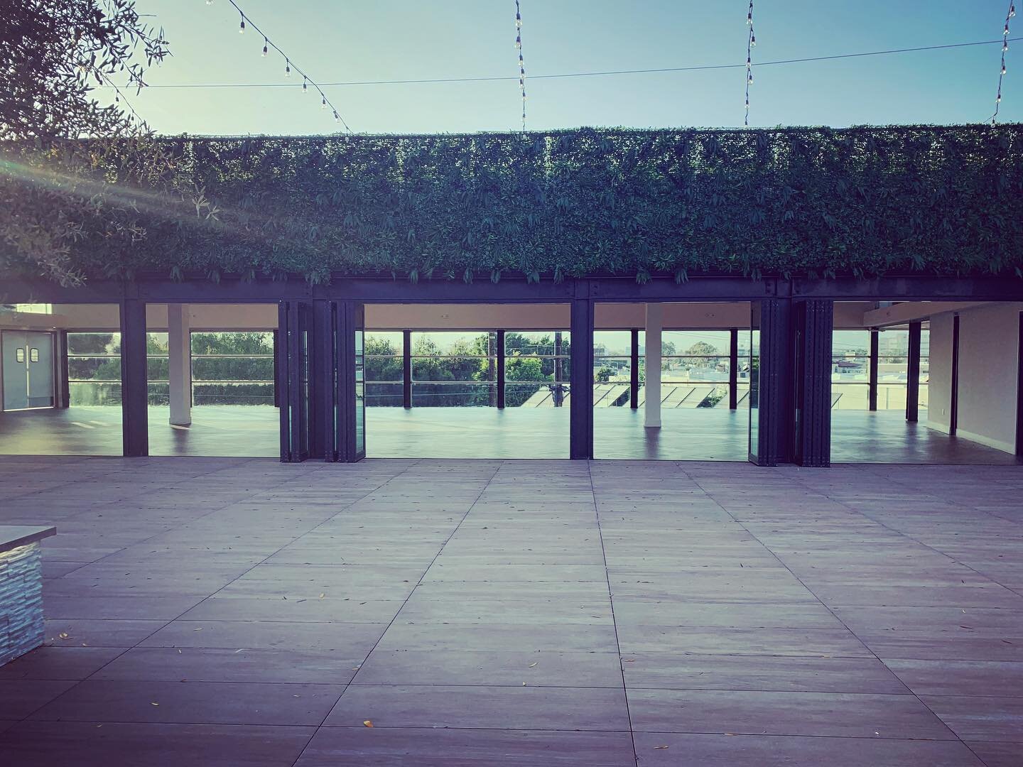 At palm Sophia rooftop in Culver City, tons of open air space is at your fingertips... not only is there 4,000 sq ft of amazing outdoor rooftop space, another 4,000 sq ft indoors seamlessly connects with the outside via two walls of Accordian doors!!
