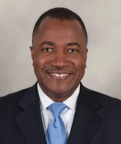 Mr. Bruce E. Caughman