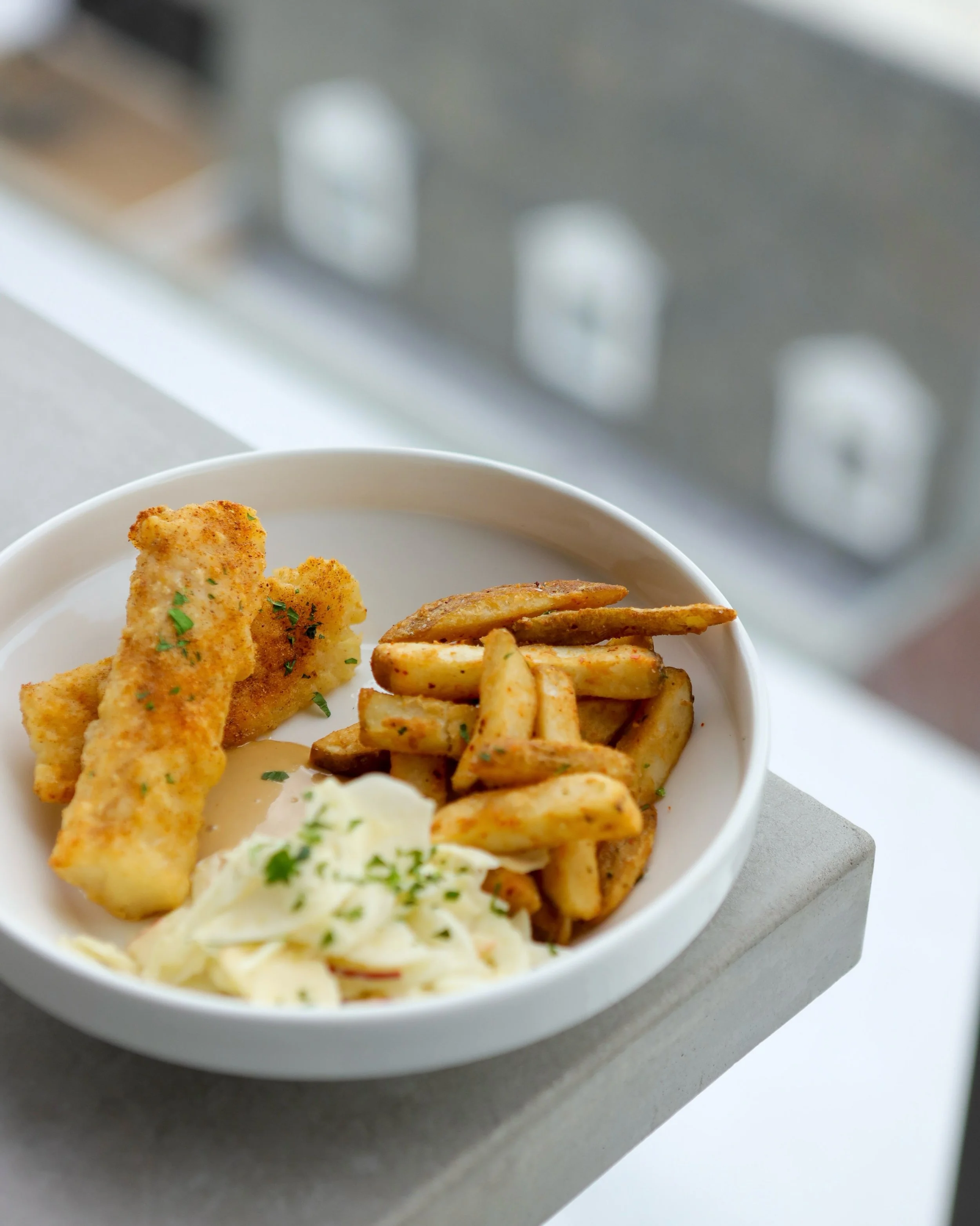 Fish &amp; Chips.

Tempura Cod, Thick Cut Fries, Black Garlic Aioli, Fennel &amp; Apple Slaw.