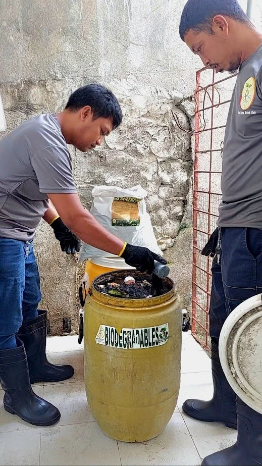 A compost starter is applied to reduce odor, deter pests and insects, and prime the waste for composting.