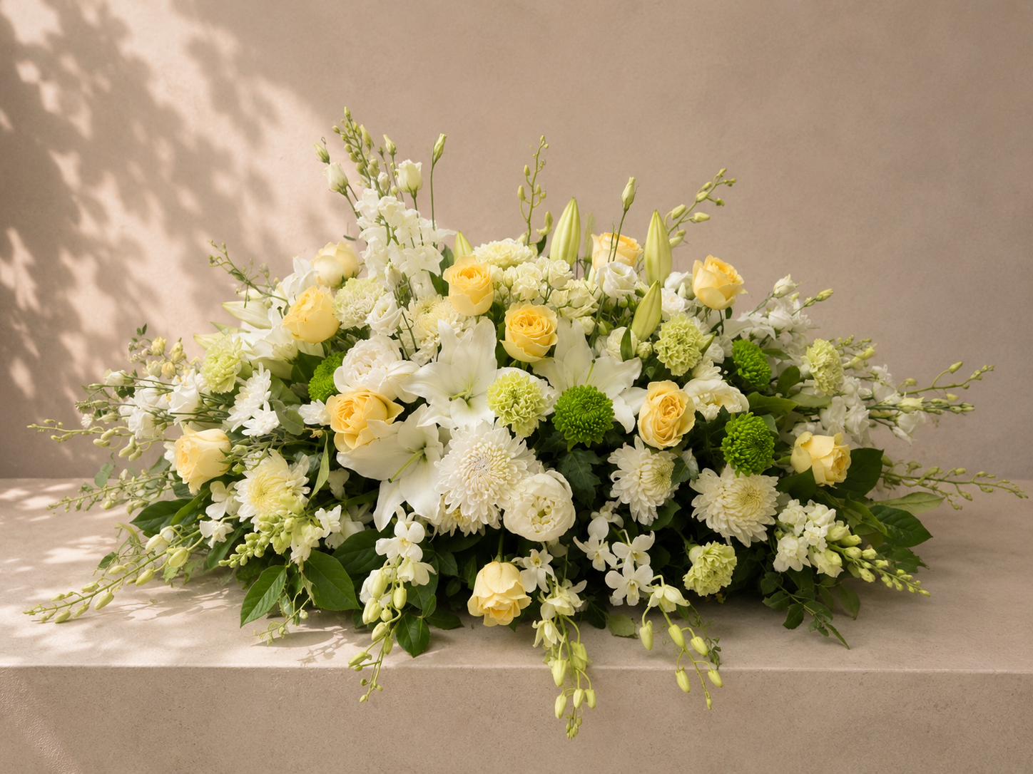 Warm Embrace casket spray