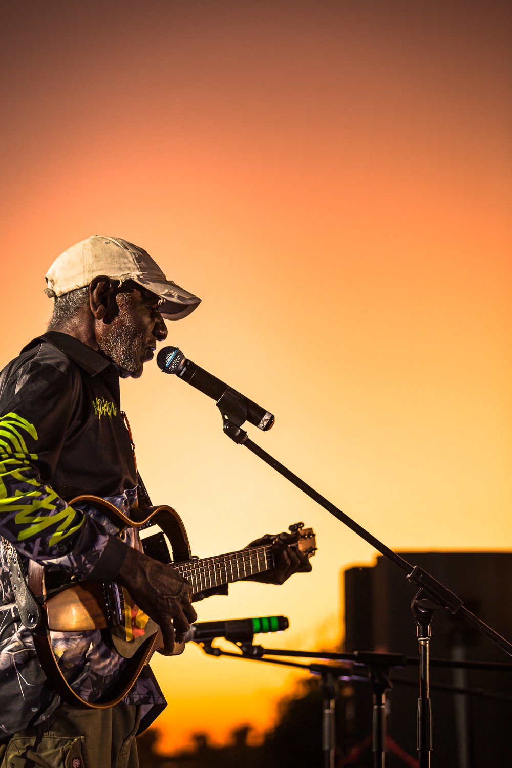 Senior Numburindi man, David Murrungun, performs an acoustic set as the sun goes down.