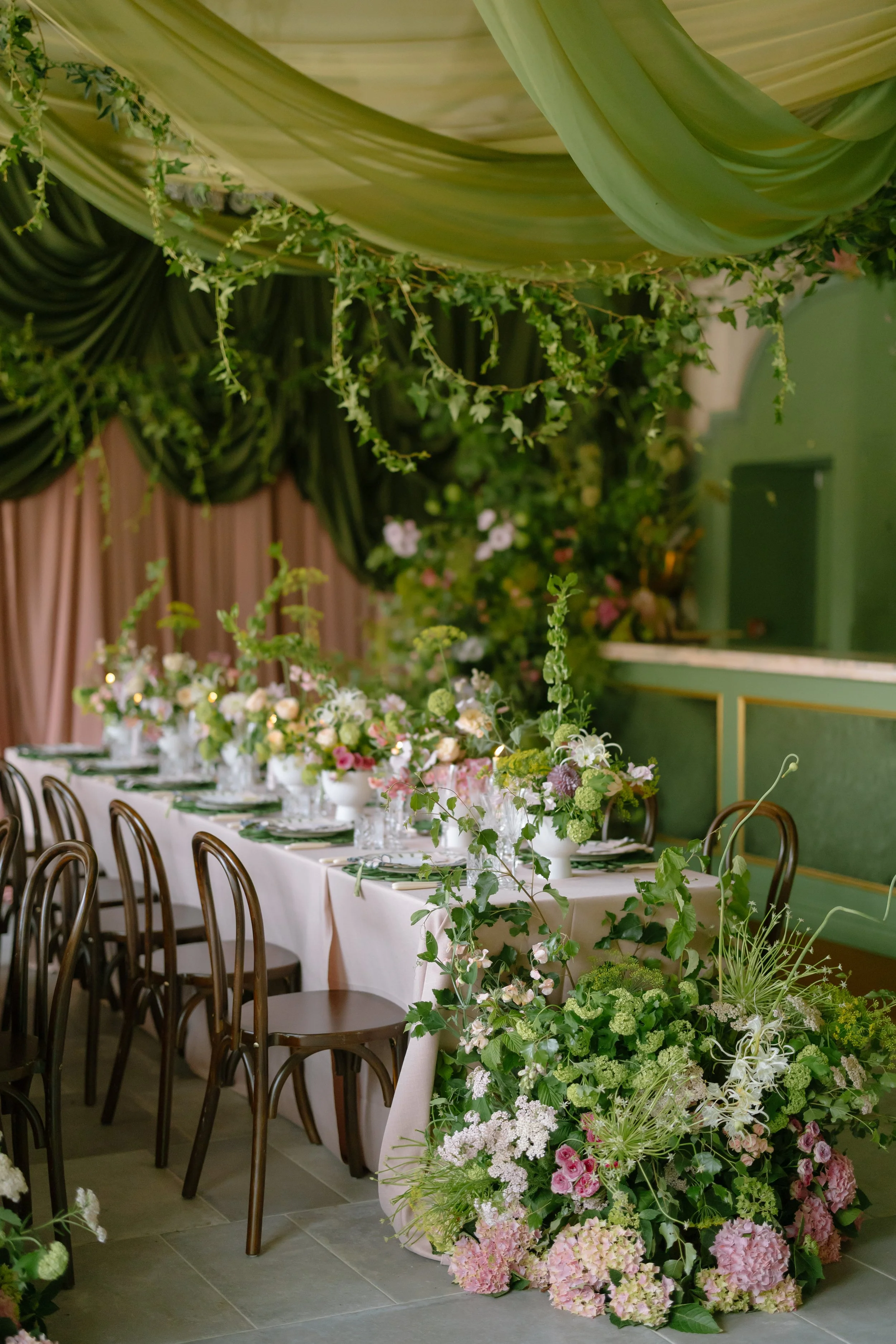 Luxury green and pink floral filled wedding dinner