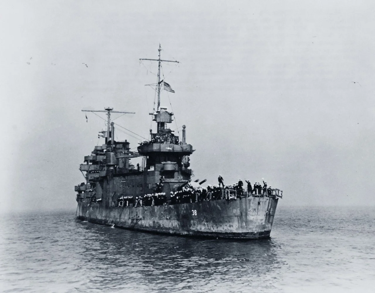 A damaged SAN FRANCISCO sailing away from Guadalcanal. 