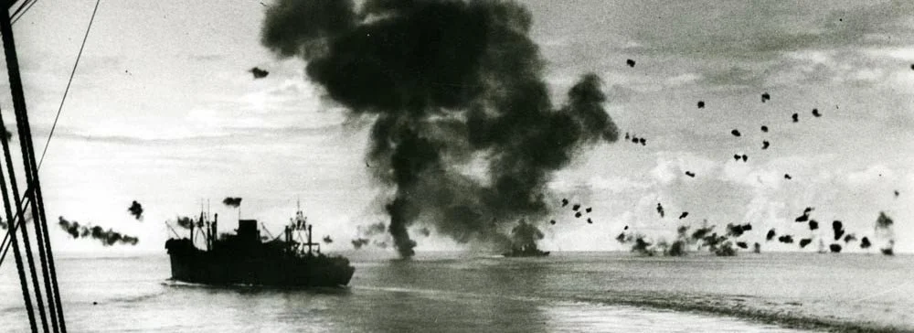 Naval Battle of Guadalcanal, 12-15 November 1942. In the center background is smoke from an enemy plane that had just crashed into the after superstructure of SAN FRANCISCO, which is steaming away in the right center. Photo from the National Archives