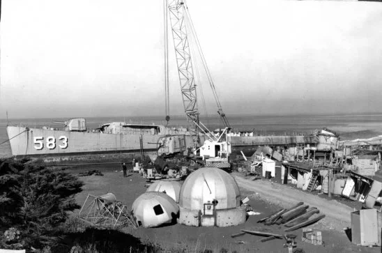 JOHNSON being scrapped along the beach. 