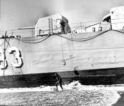 Larry Rody leaving the ship to retrieve supplies, leaving Paul Farley aboard to keep their claim. Photo from DEHM.