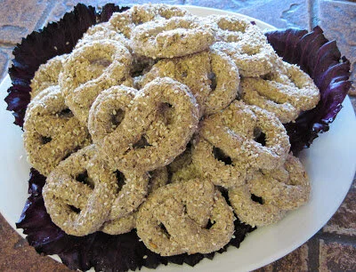 Raw Vegan Pretzels made from sprouted spelt, sesame seeds, caraway, olive oil and salt.
